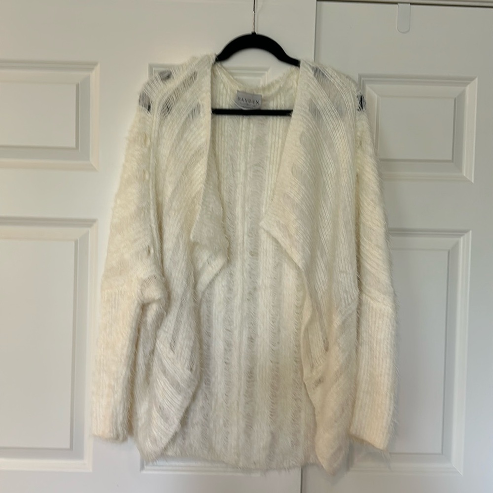 Distressed white sweater